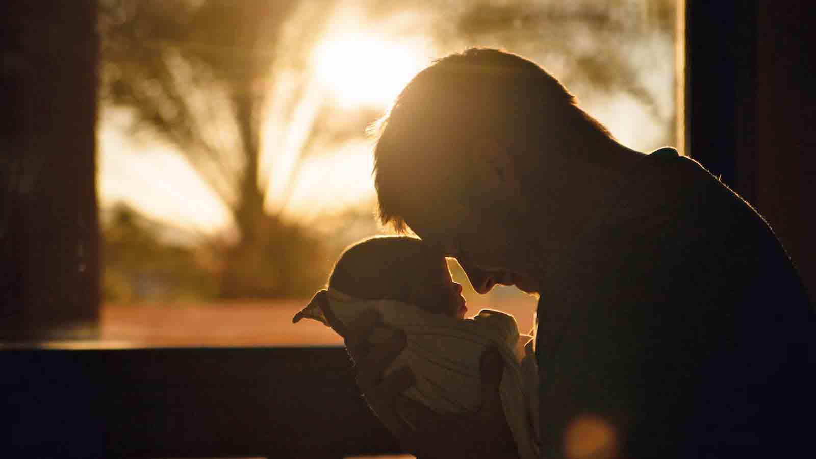 Man holds a infant...