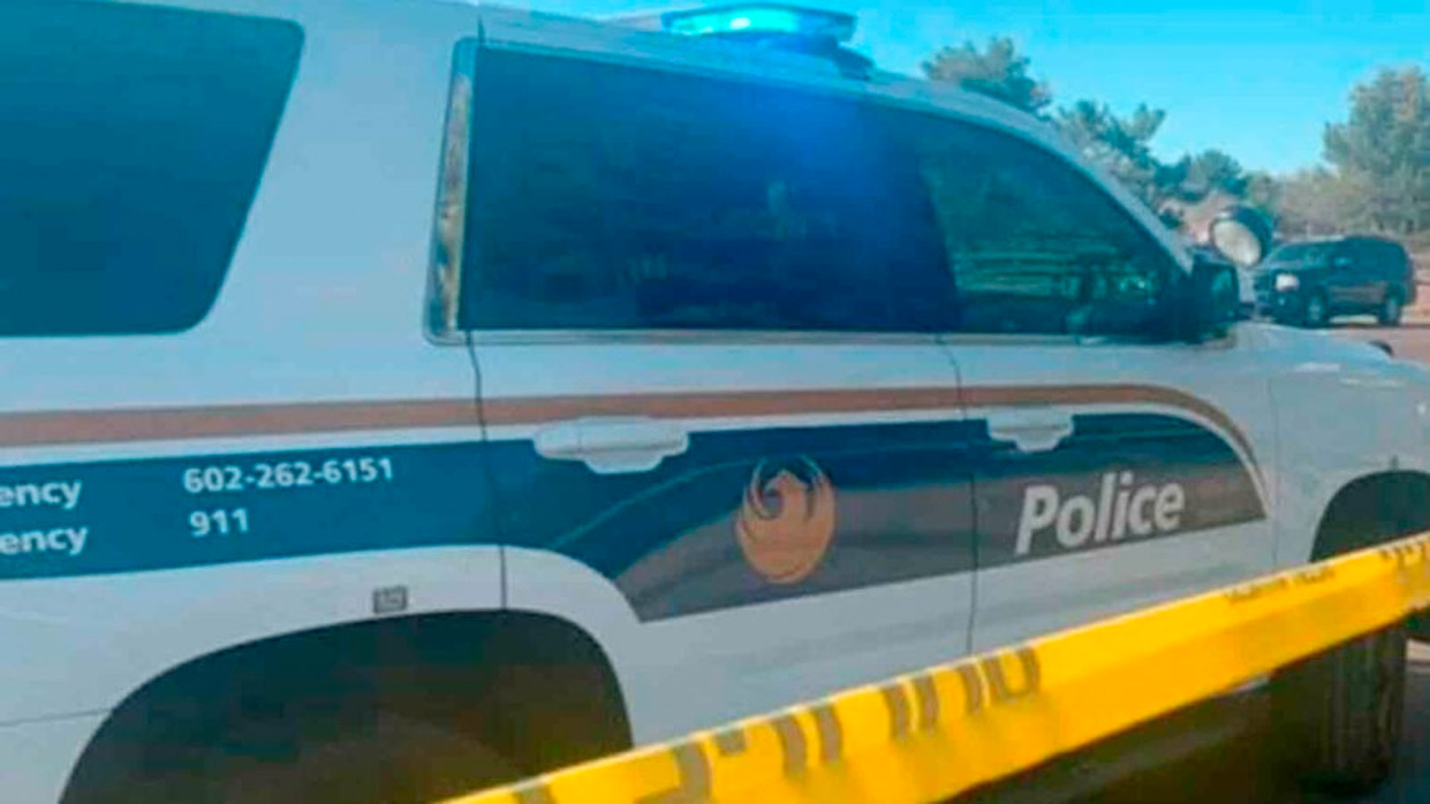 Phoenix patrol vehicle with caution tape nearby....