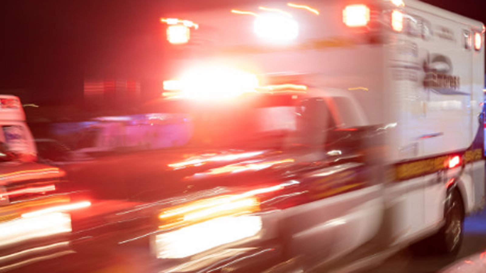 Blurry file photo of an ambulance with lights on...