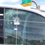 Bullet hole in Phoenix police patrol vehicle. 
