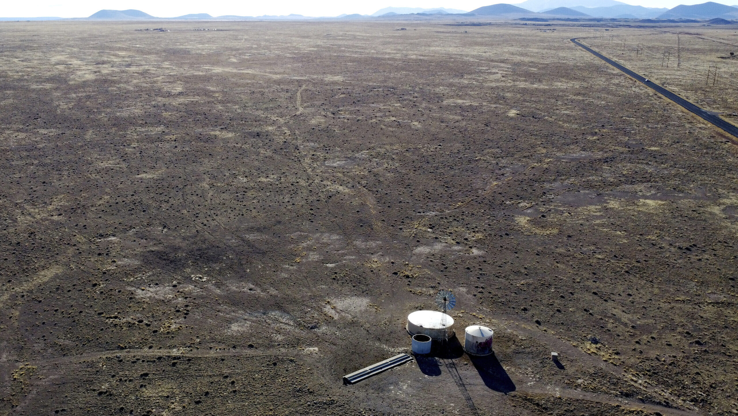 A windmill draws water for livestock in Leupp, Ariz., on the Navajo Nation, March 9, 2024. (AP Phot...
