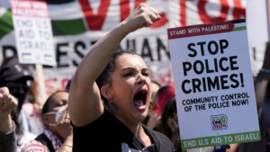Protesters break through police fence near site of Democratic National Convention
