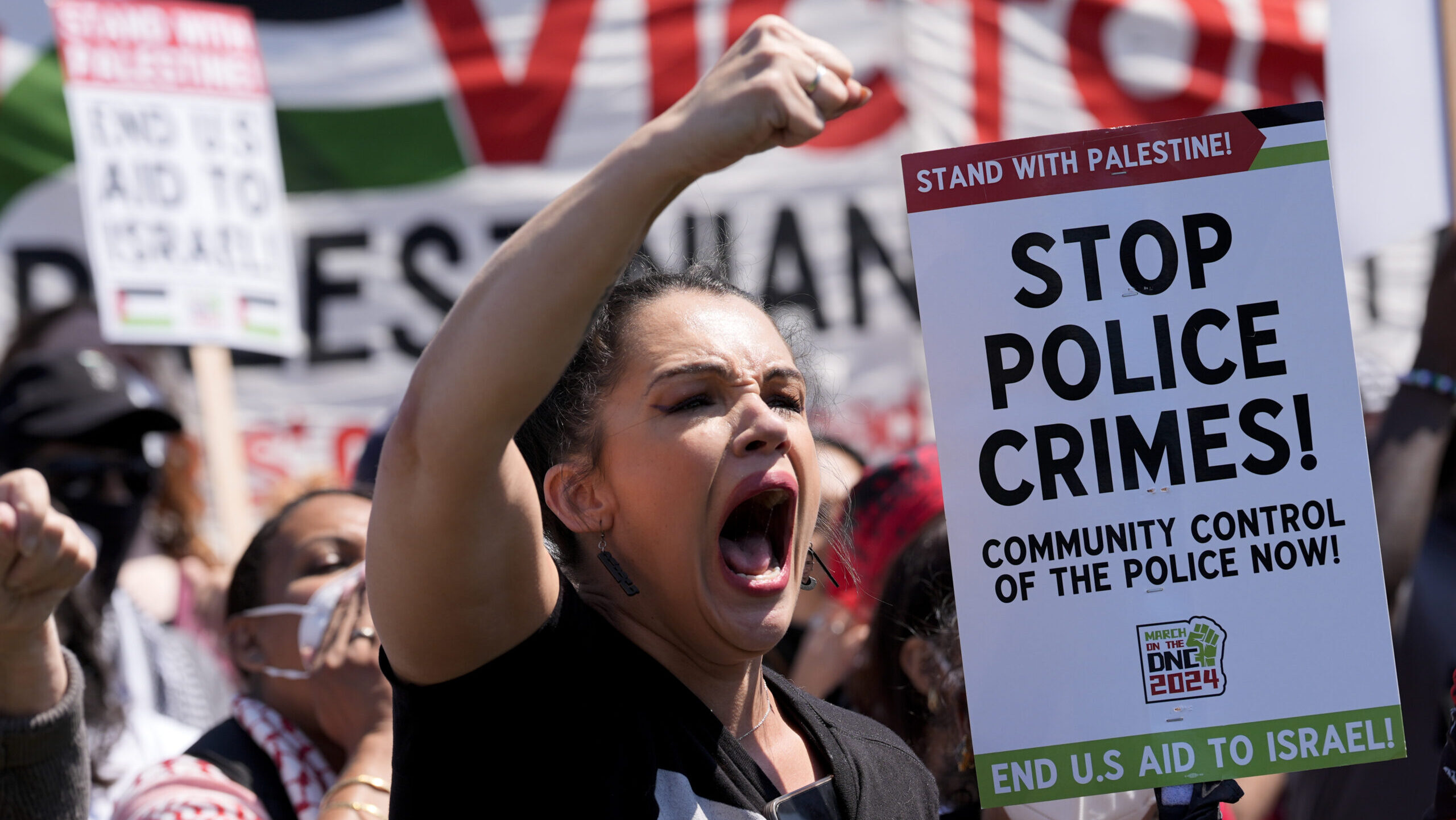 A pro-Palestinian protestor yells at a protest near the Democratic National Convention....