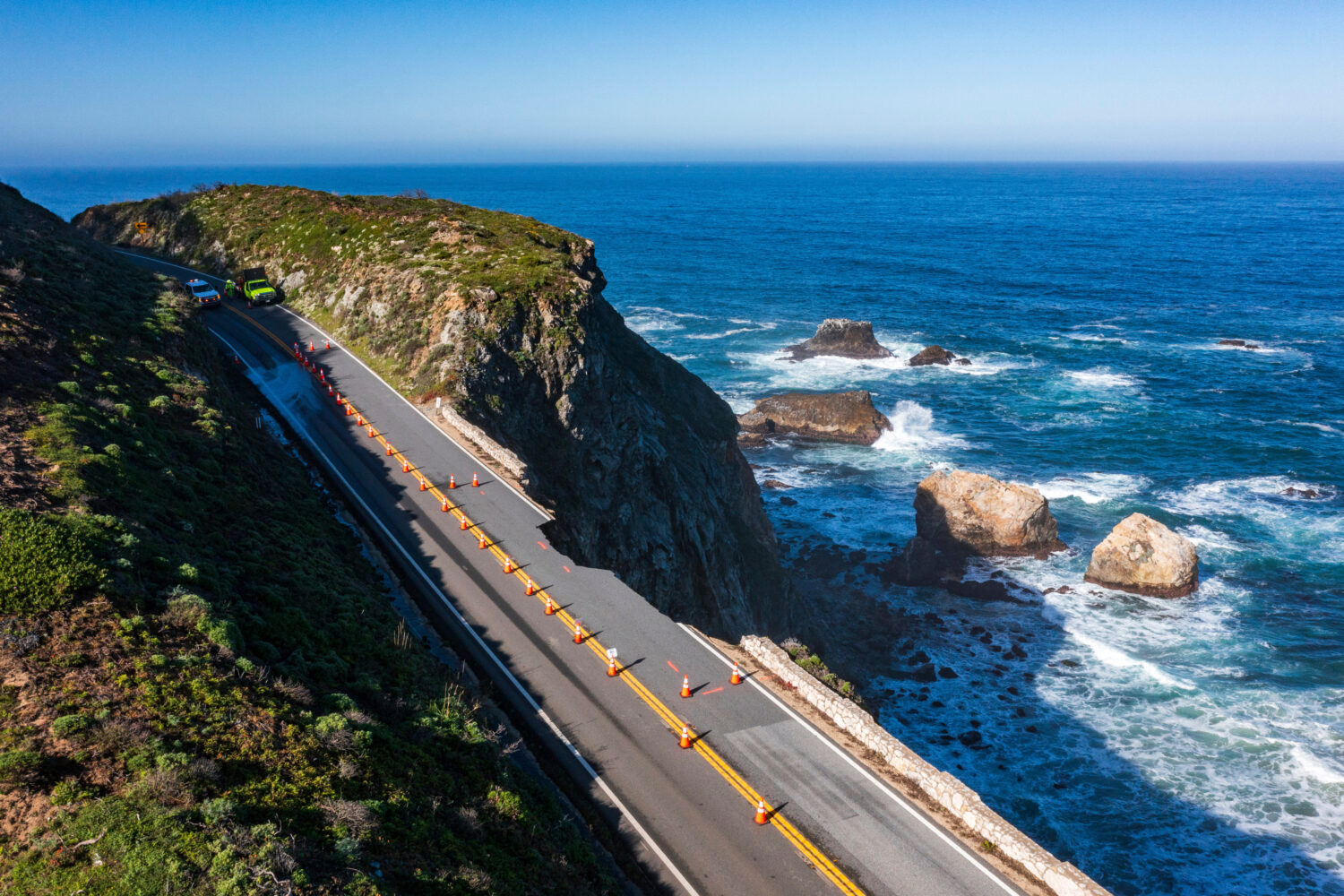 FILE - Cones mark a break in the southbound lane of Highway 1 at Rocky Creek Bridge in Big Sur, Cal...