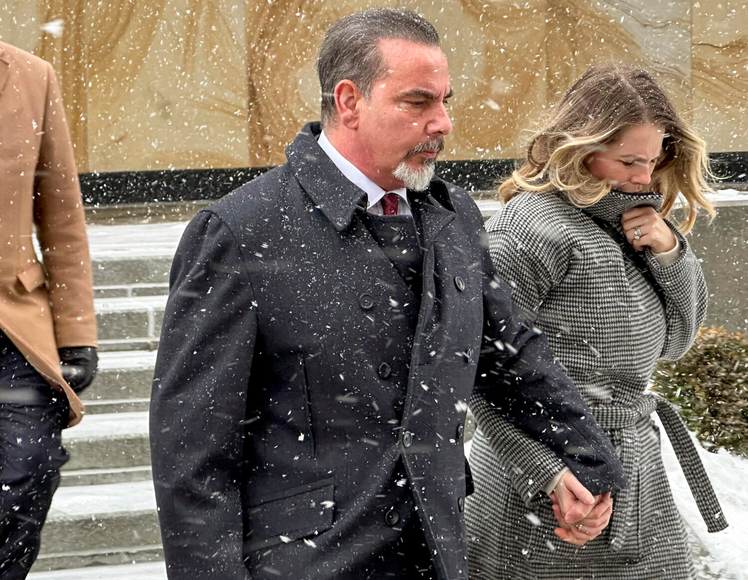 Joseph Bongiovanni, left, leaves federal court with his wife, Lindsay Bongiovanni, after being sent...
