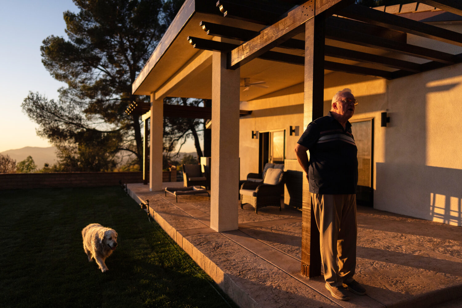 Ted Koerner, whose home was reduced to ash in the 2025 wildfires, stands on the porch of his newly ...