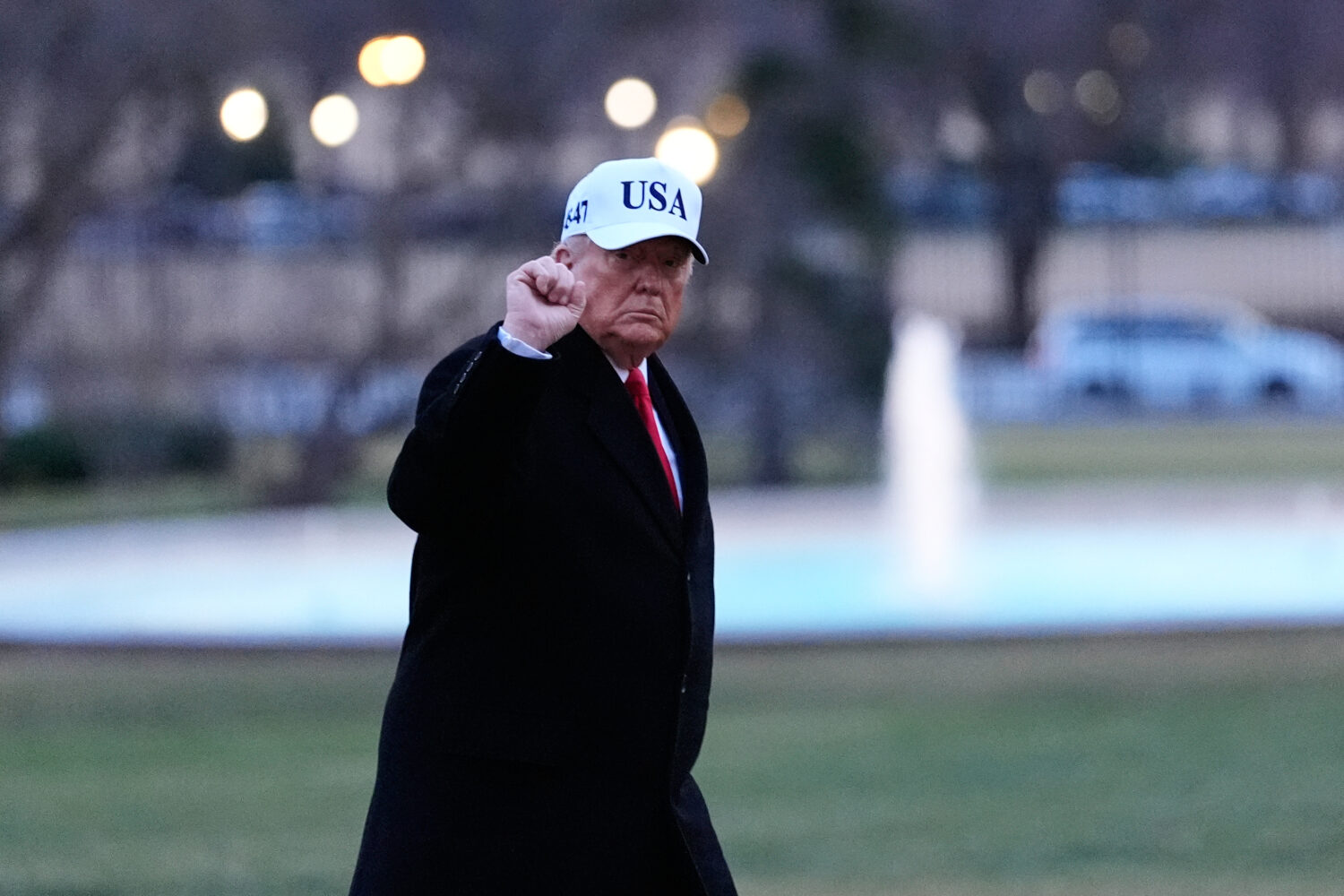 President Donald Trump gestures as he walks from Marine One after arriving on the South Lawn of the...