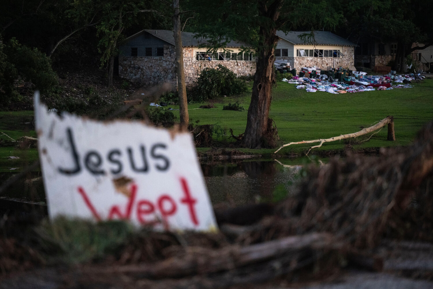 FILE - Campers' belongings sit outside one of Camp Mystic's cabins near the Guadalupe River, Monday...