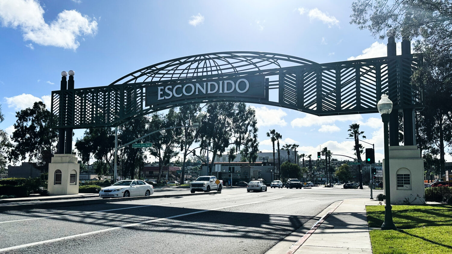 Motorists drive under a city sign on Wednesday, Feb. 18, 2026 in Escondido, Calif. (AP Photo/Amy Ta...