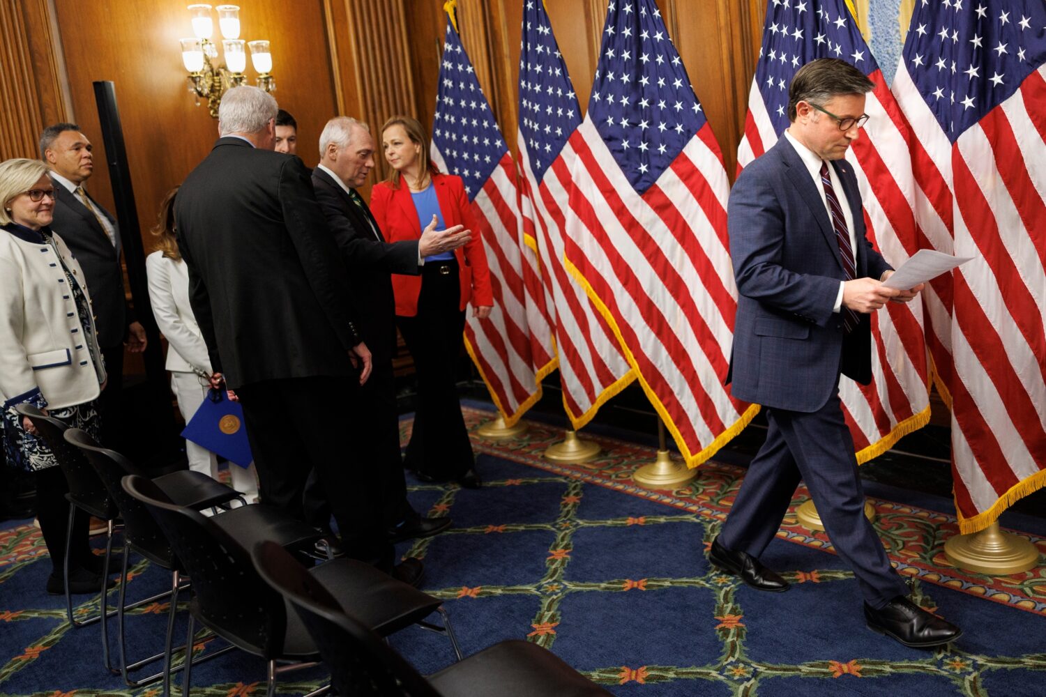House Speaker Mike Johnson, R-La., reads notes before speaking about the SAVE America Act to report...
