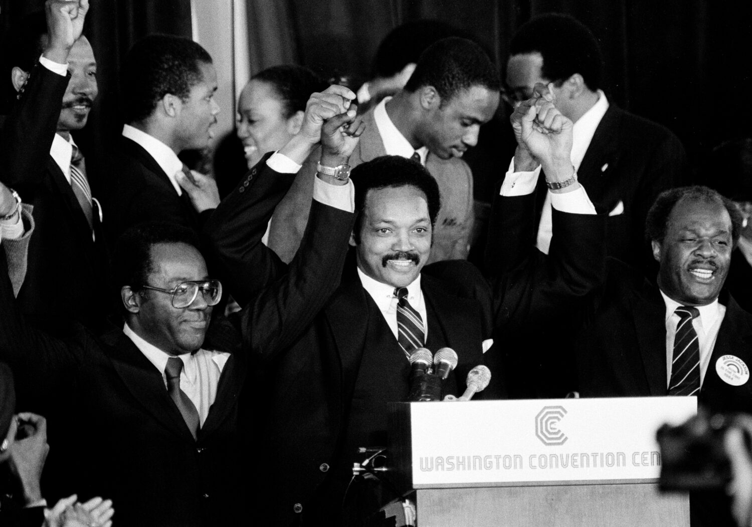 FILE - Jesse Jackson holds his hands up after announcing he will seek the Democratic nomination for...