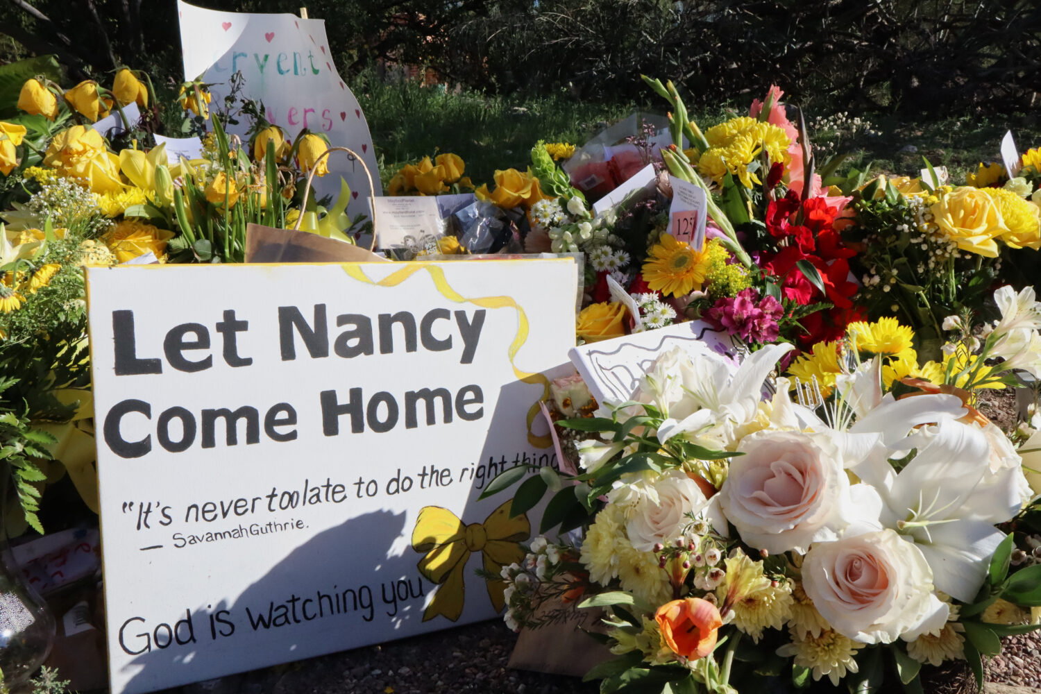 A memorial grows outside the home of Nancy Guthrie, the missing mother of "Today" show host Savanna...