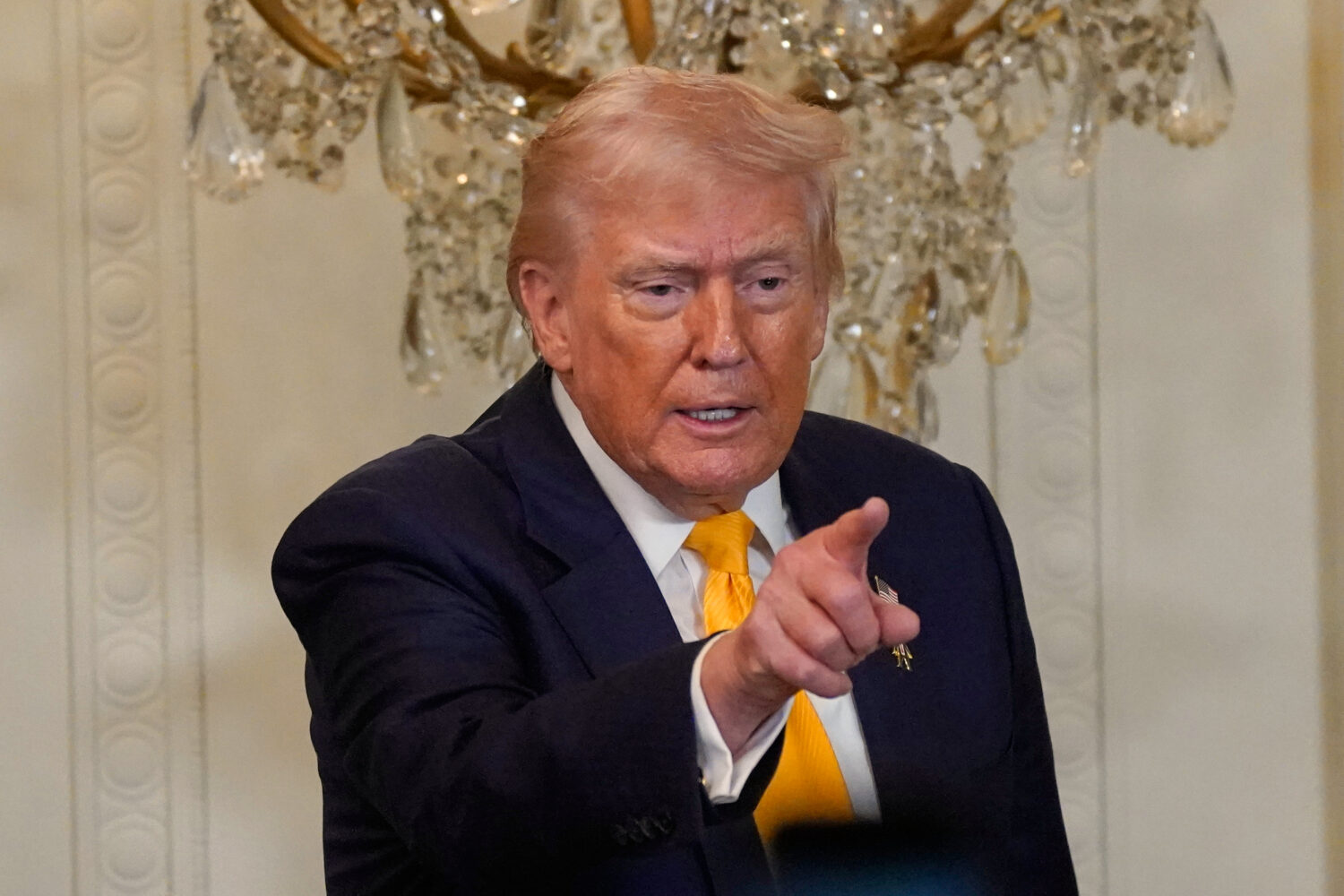 President Donald Trump gestures during a Black History Month event in the East Room of the White Ho...