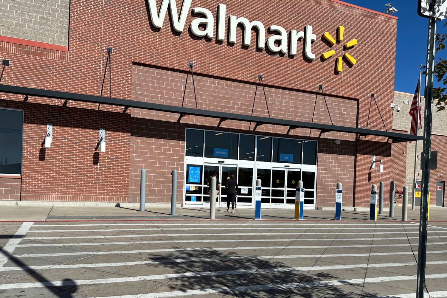 FILE - A shopper heads into a Walmart store Thursday, Oct. 16, 2025, in Englewood, Colo. (AP Photo/...