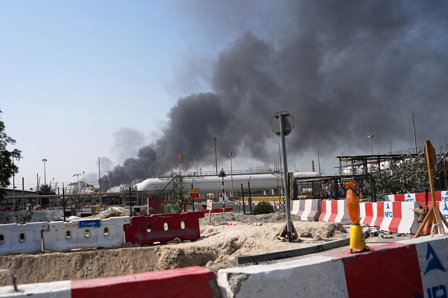 Smoke rises after an Iranian drone attack in the port area of Dubai, United Arab Emirates, Sunday, ...