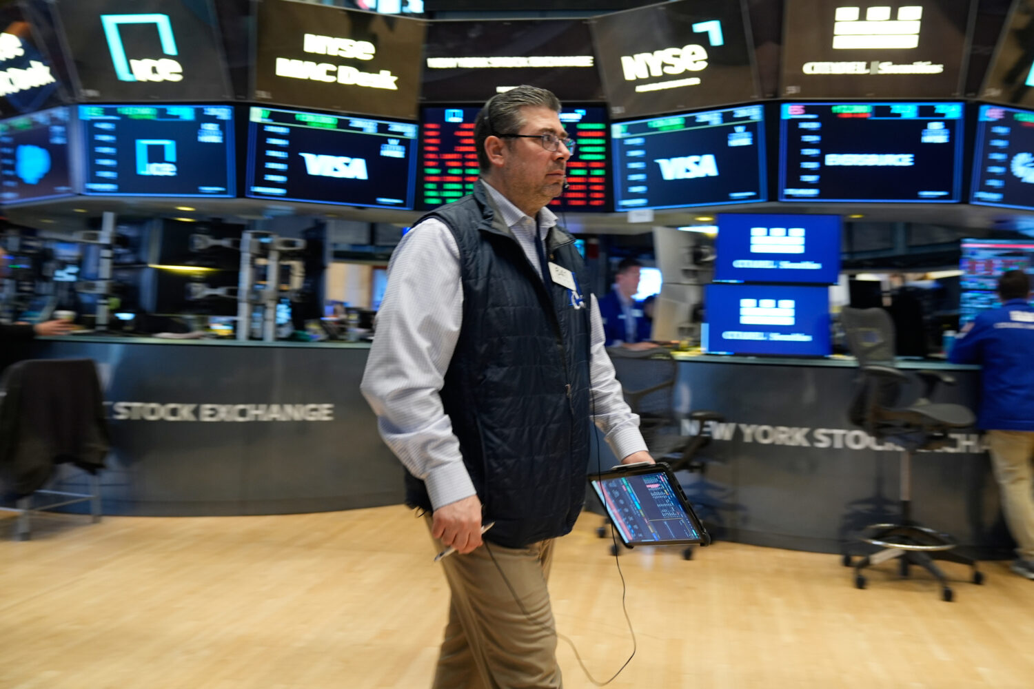 Michael Capolino works on the floor at the New York Stock Exchange in New York, Thursday, March 19,...