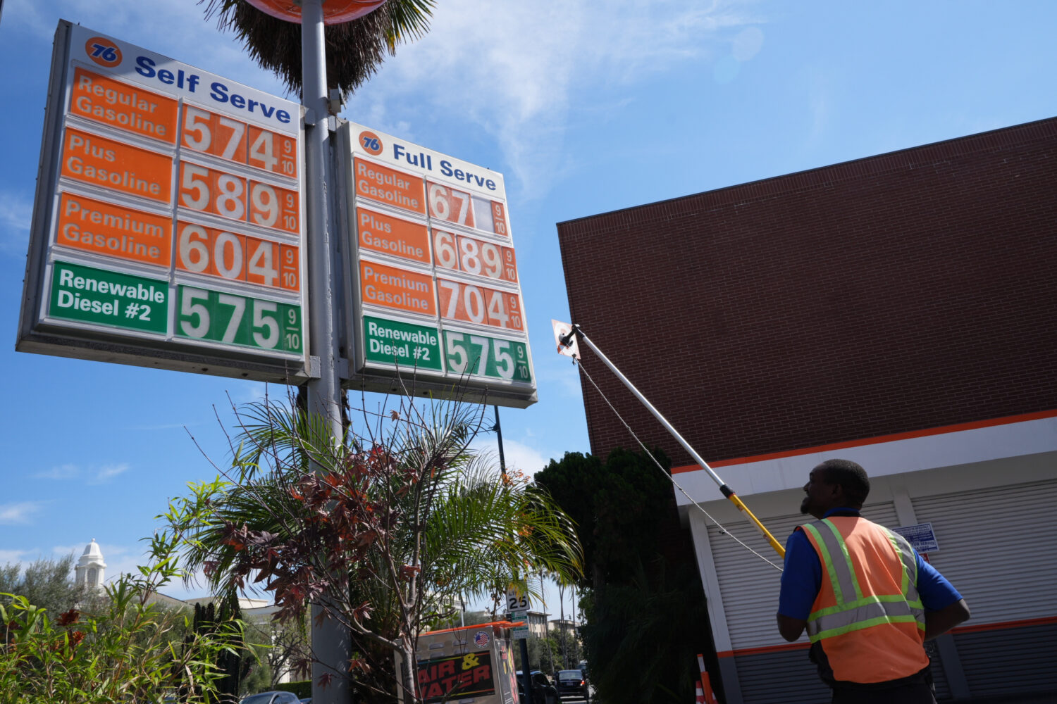 Gas prices are manually increased in Beverly Hills, Calif., Tuesday, March 3, 2026. (AP Photo/Damia...
