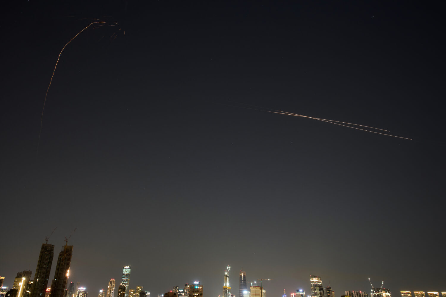 Israeli air defense system fires to intercept missiles during an Iranian attack over Tel Aviv, Isra...