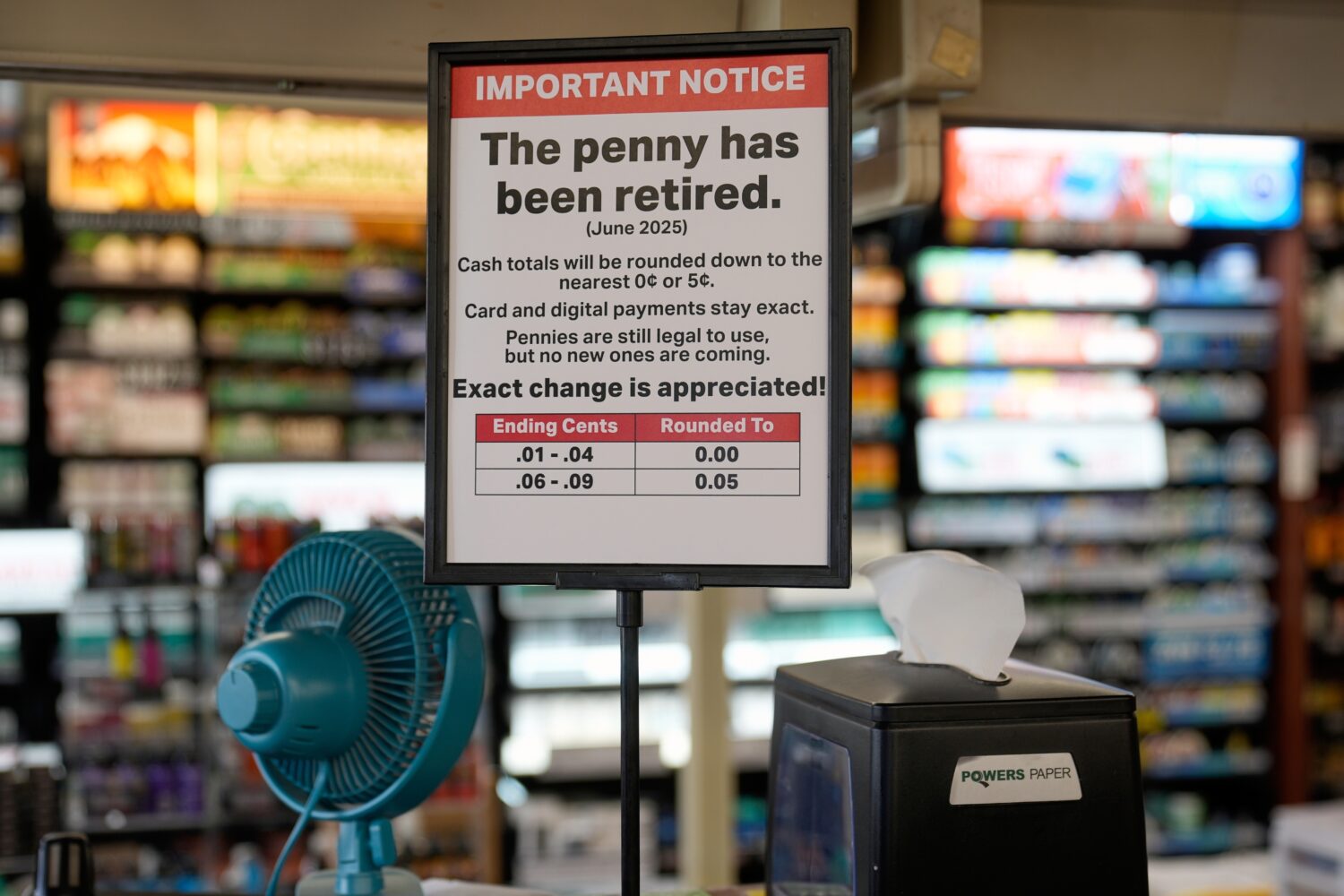 FILE - A sign in a Kwik Trip store shows the store will no longer be using pennies to give change, ...