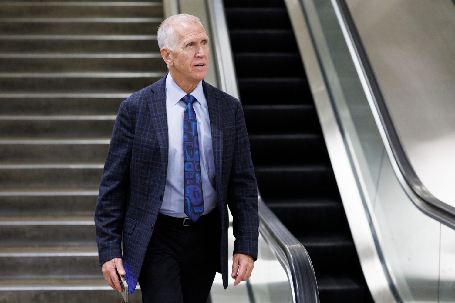 Sen. Thom Tillis, R-N.C., descends an stairwell after a vote at the Capitol, Friday, March 20, 2026...