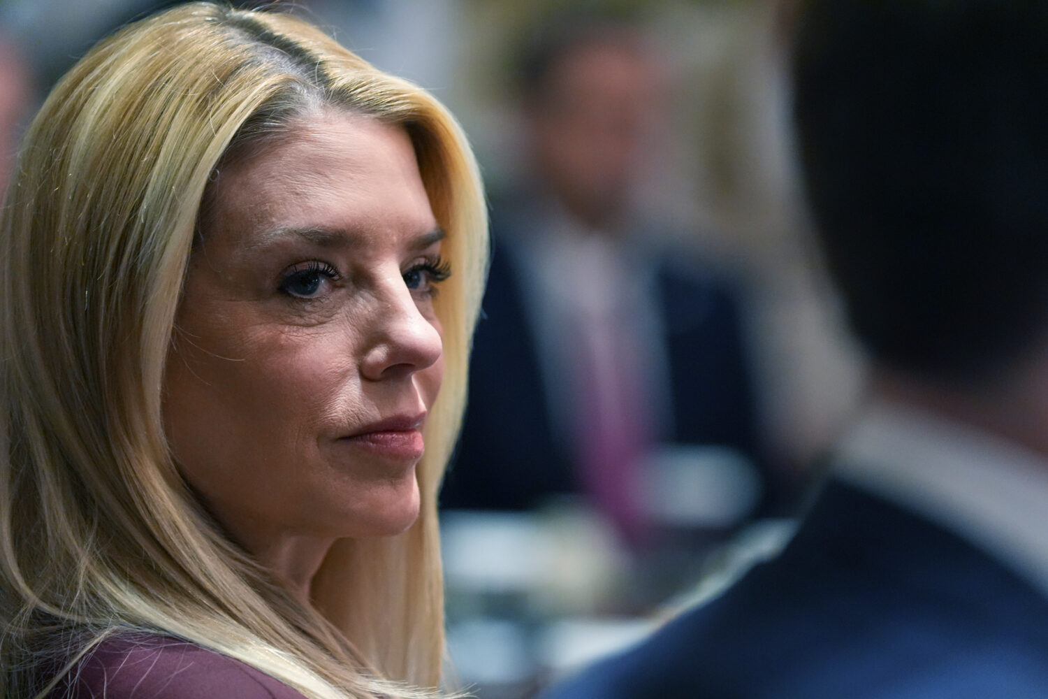 Attorney General Pam Bondi listens during a Cabinet meeting at the White House, Thursday, March 26,...