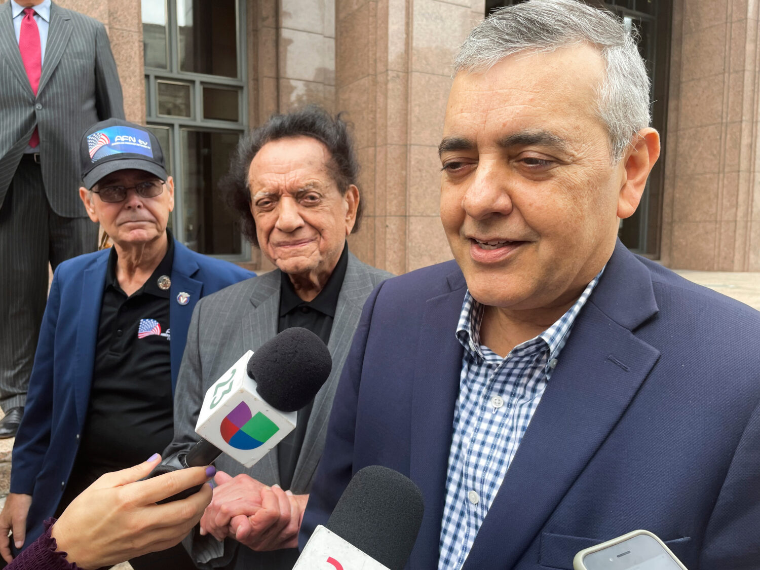 FILE - Former U.S. Rep. David Rivera speaks with media outside a federal court in Miami, Dec. 20, 2...
