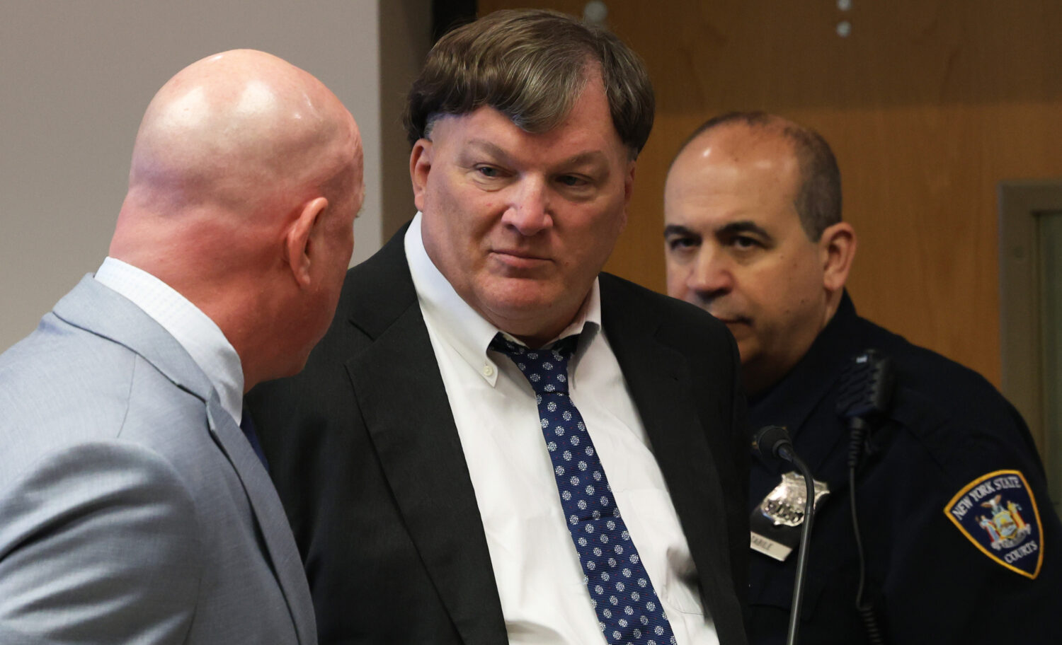 Rex A. Heuermann, center, pleads guilty to murdering seven women and admitted he killed an eighth i...