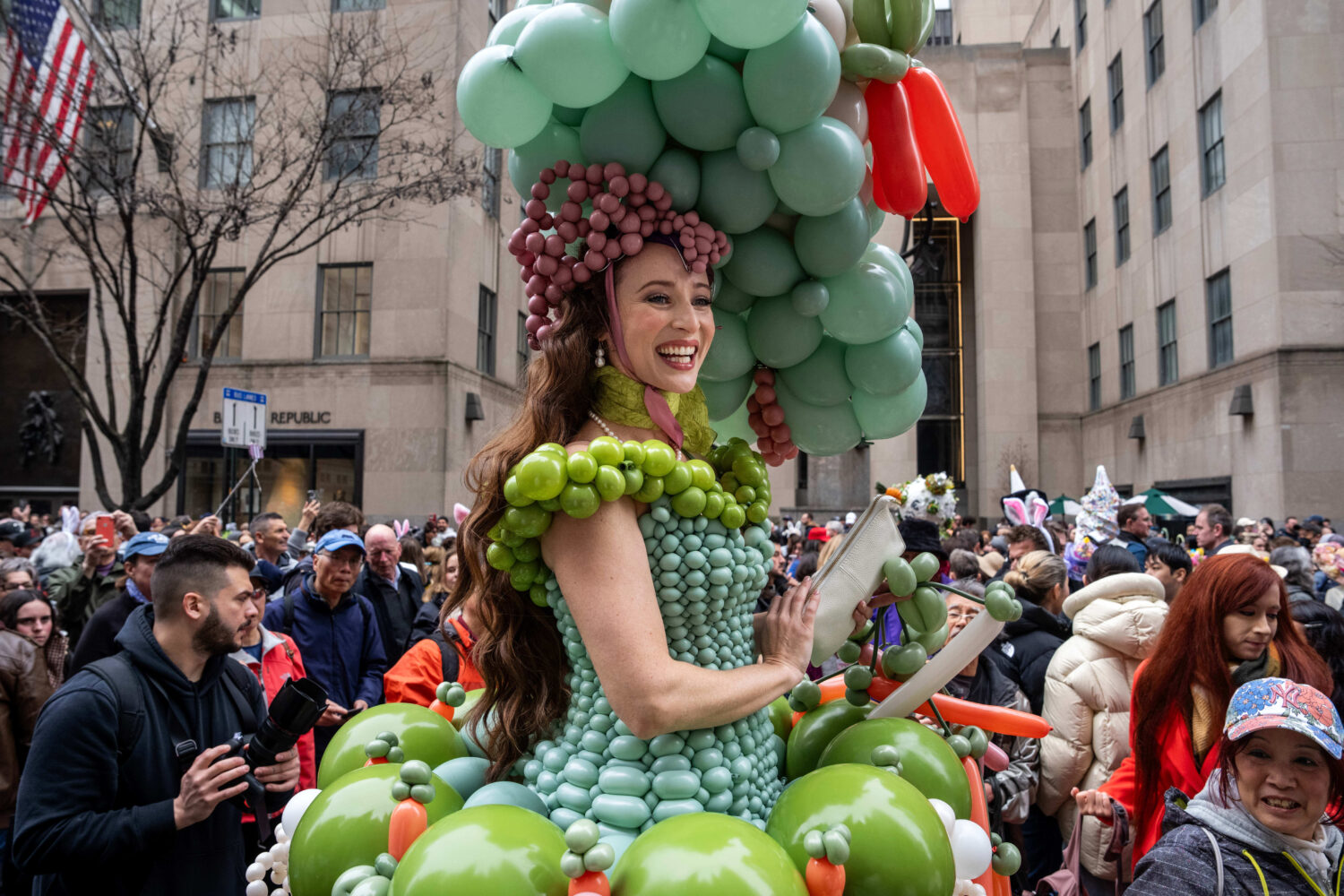 Tommi May wears a costume of balloons as they participate in the Easter Bonnet Parade on Fifth Aven...