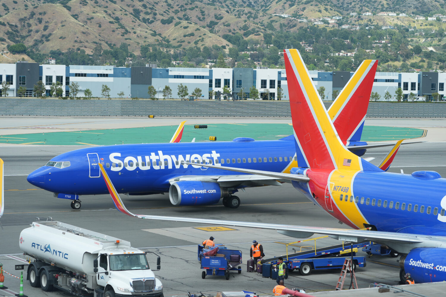 Southwest Airlines grounds crew refuel an aircraft at Hollywood Burbank Airport in Burbank, Calif.,...