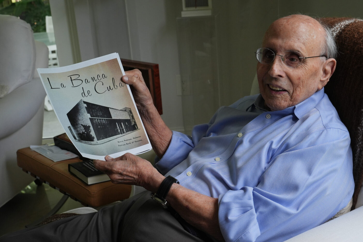 Raul Valdes-Fauli holds a picture of the family-owned Pedroso Bank in Havana during an interview Tu...