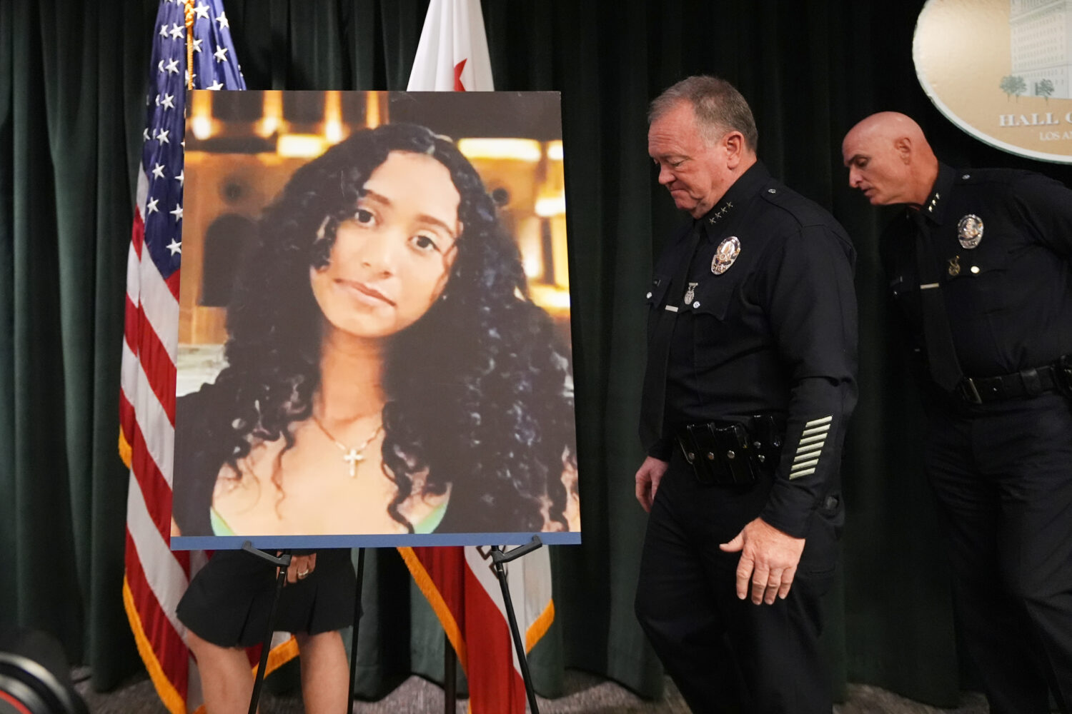 LAPD Chief Jim McDonnell walks past an image of Celeste Rivas Hernandez Monday, April 20, 2026, in ...