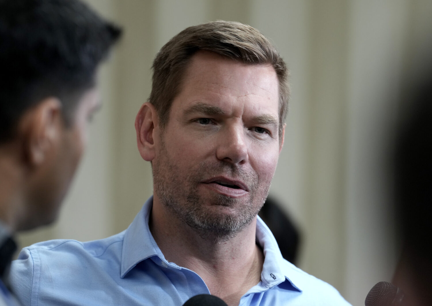 California gubernatorial candidate Rep. Eric Swalwell, D-Calif., talks with reporters after holding...