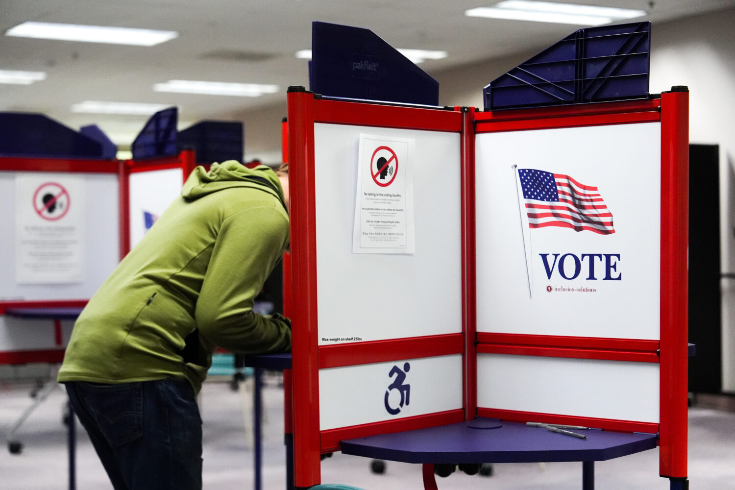 A person votes early in the Virginia redistricting referendum at the Fairfax County Government Cent...