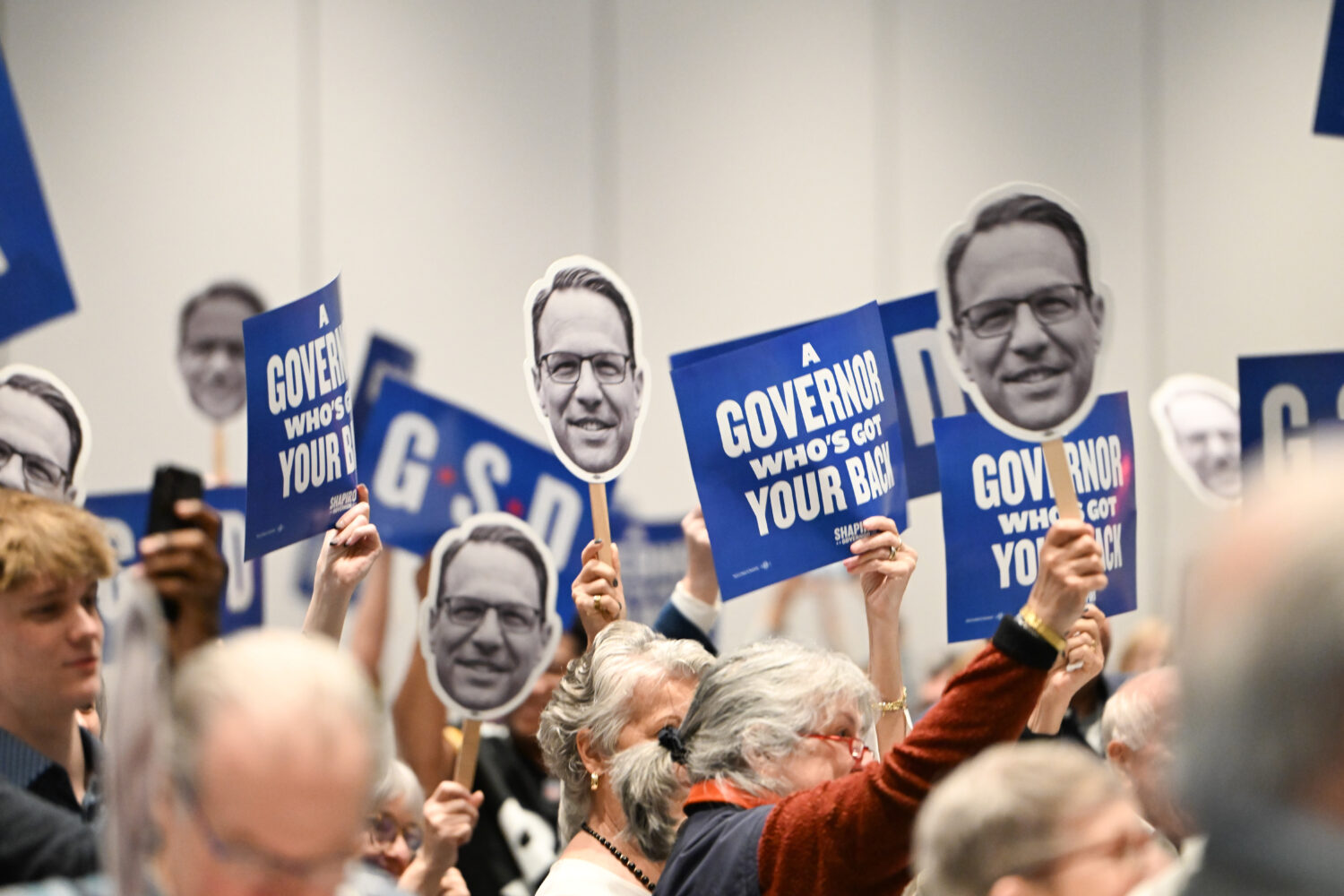 FILE - The crowd reacts to Pennsylvania Gov. Josh Shapiro while he speaks at a Centre County Democr...