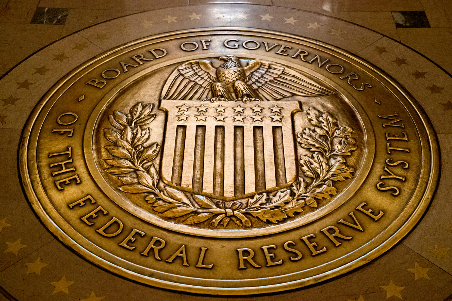 FILE- In this Feb. 5, 2018, file photo, the seal of the Board of Governors of the United States Fed...