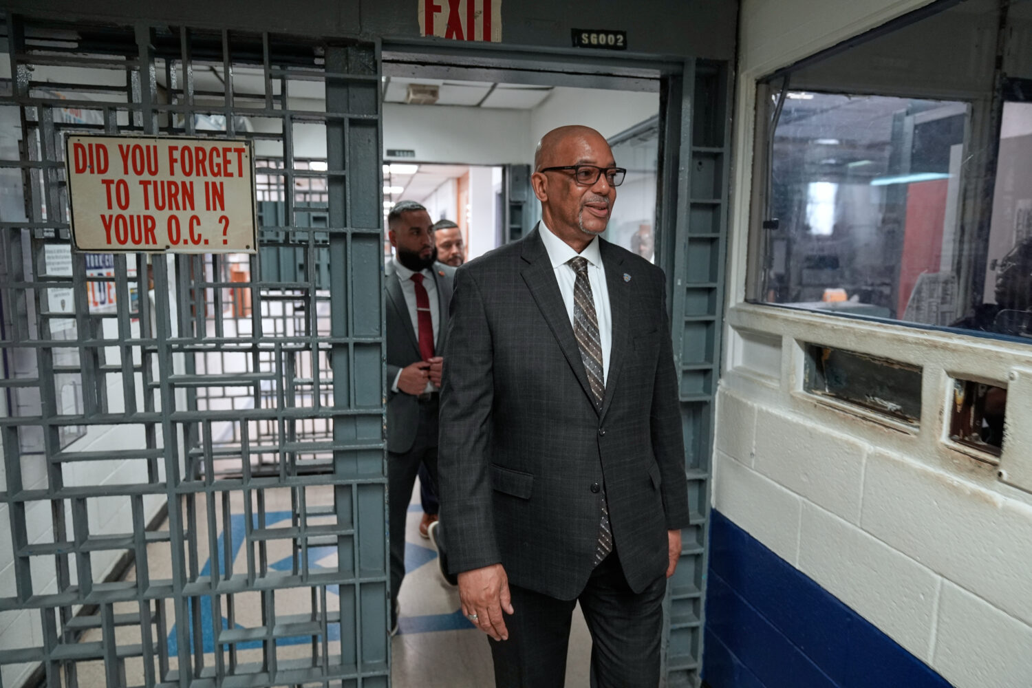 Stanley Richards, NYC Department of Correction commissioner, walks through security in the building...