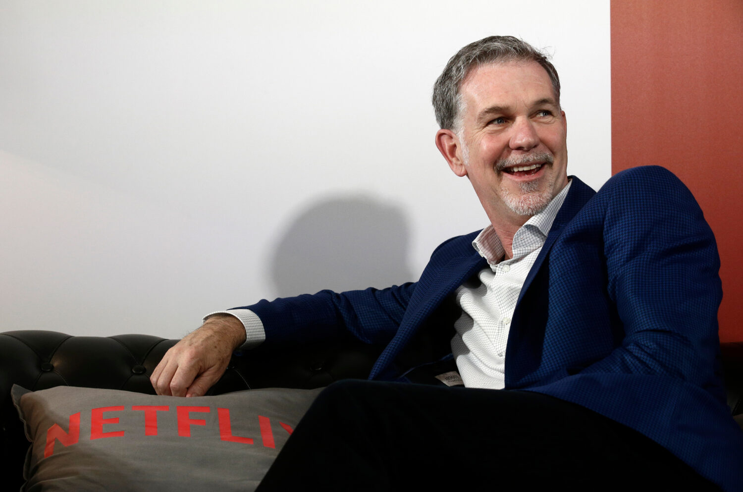 FILE - Netflix founder and CEO Reed Hastings smiles during an interview in Barcelona, Spain, Feb. 2...
