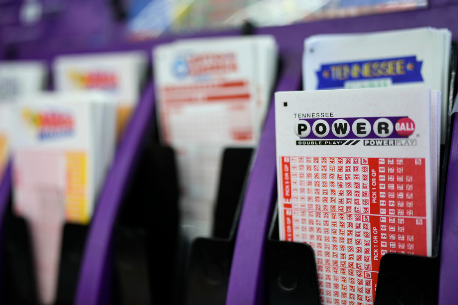 FILE - A Powerball play slip is seen at a store, Dec. 17, 2025, in Nashville, Tenn. (AP Photo/Georg...