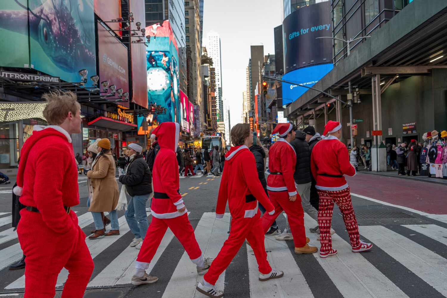 FILE - Revelers take part in SantaCon, Dec. 14, 2024, in New York. (AP Photo/Julia Demaree Nikhinso...