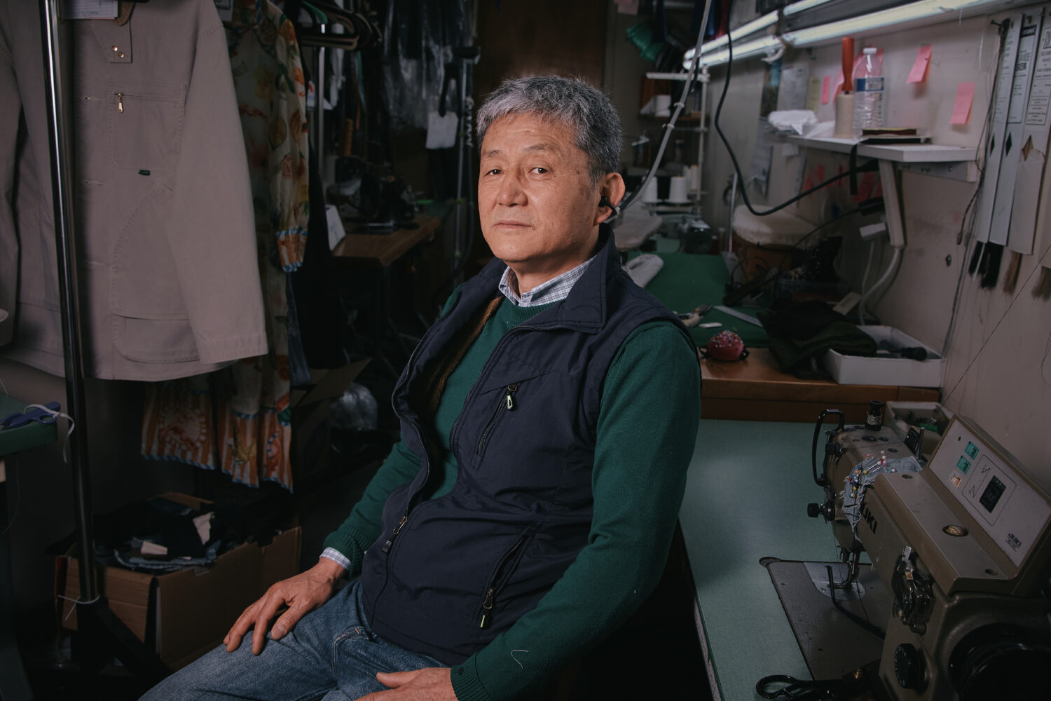 Tailor, Kil Bae, poses for a photo inside his shop on Friday, March 27, 2026, in New York. (AP Phot...