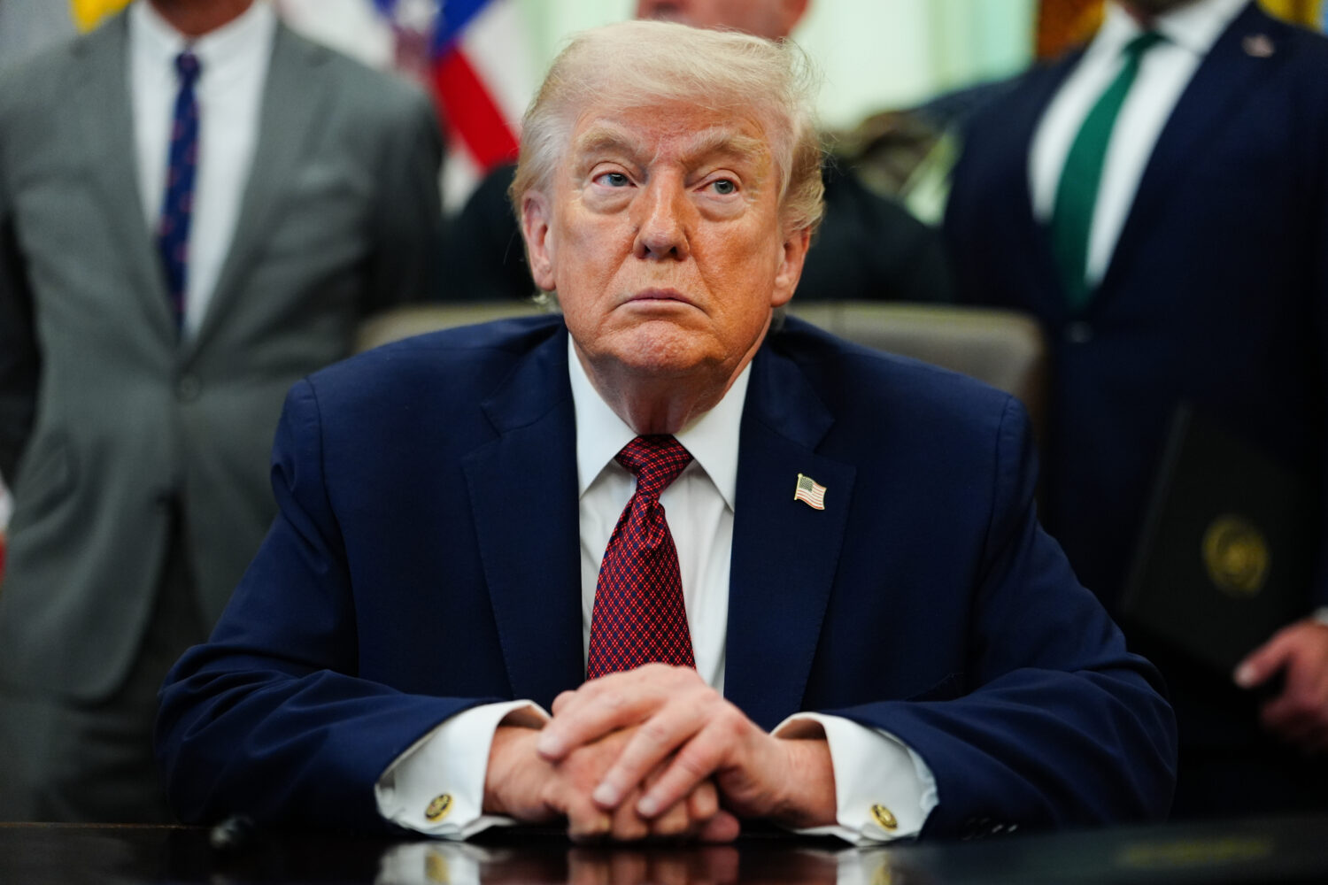 President Donald Trump listens in the Oval Office of the White House, Saturday, April 18, 2026, in ...