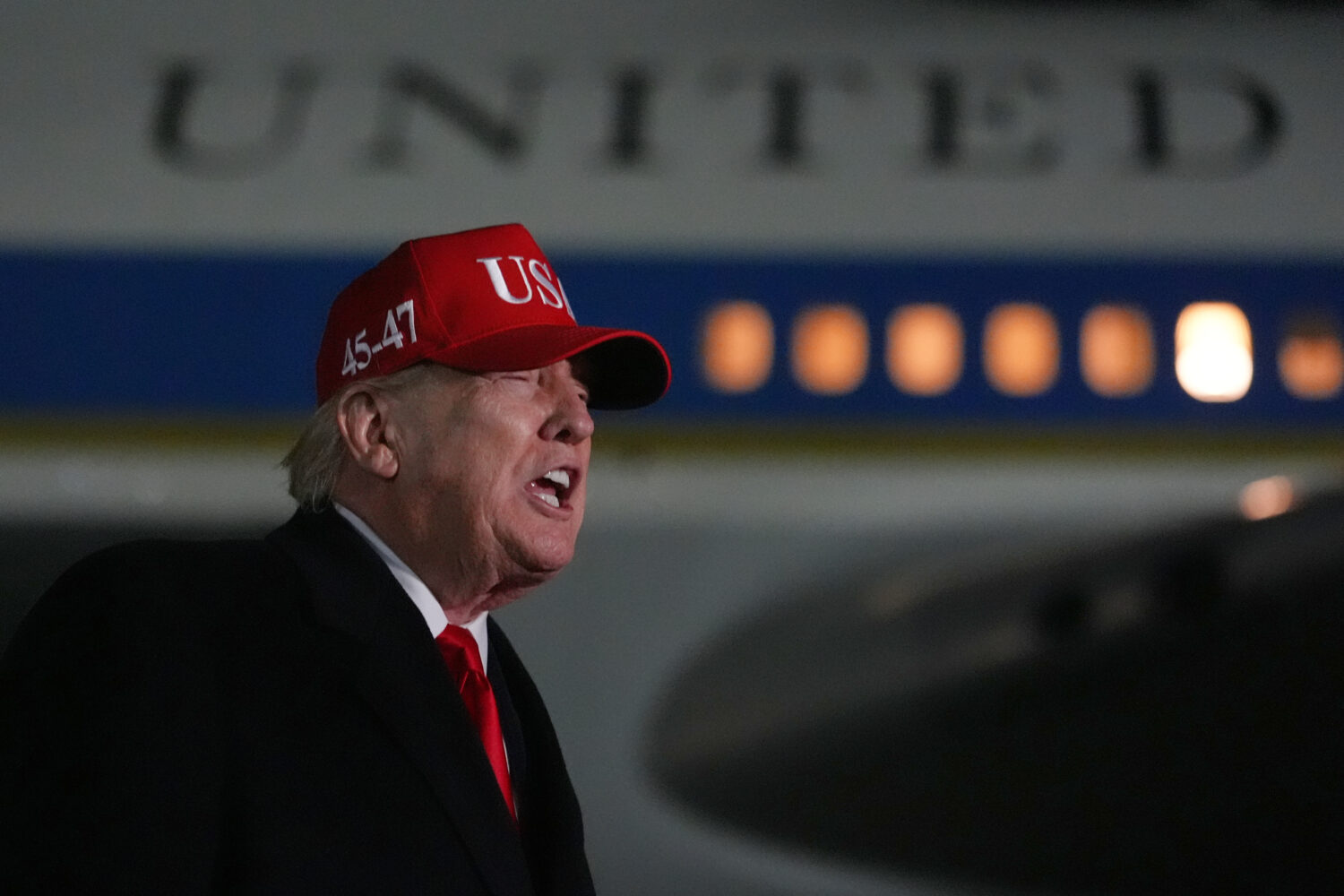 President Donald Trump speaks with reporters at Joint Base Andrews, Md., Sunday, April 12, 2026, af...