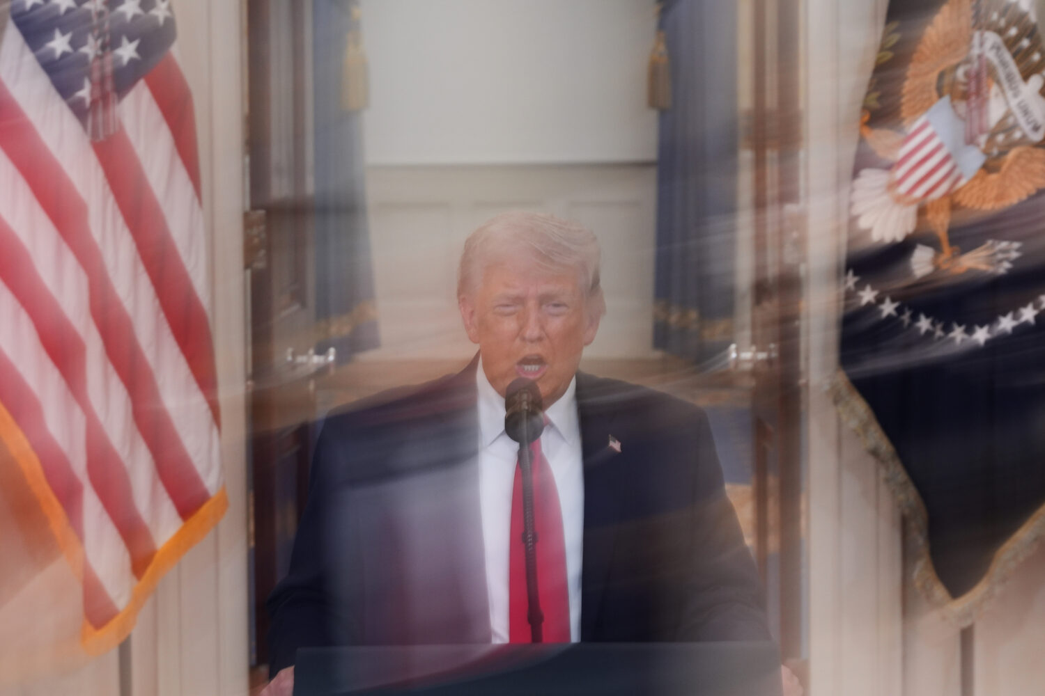 In this image made with a long exposure, President Donald Trump speaks about the Iran war from the ...