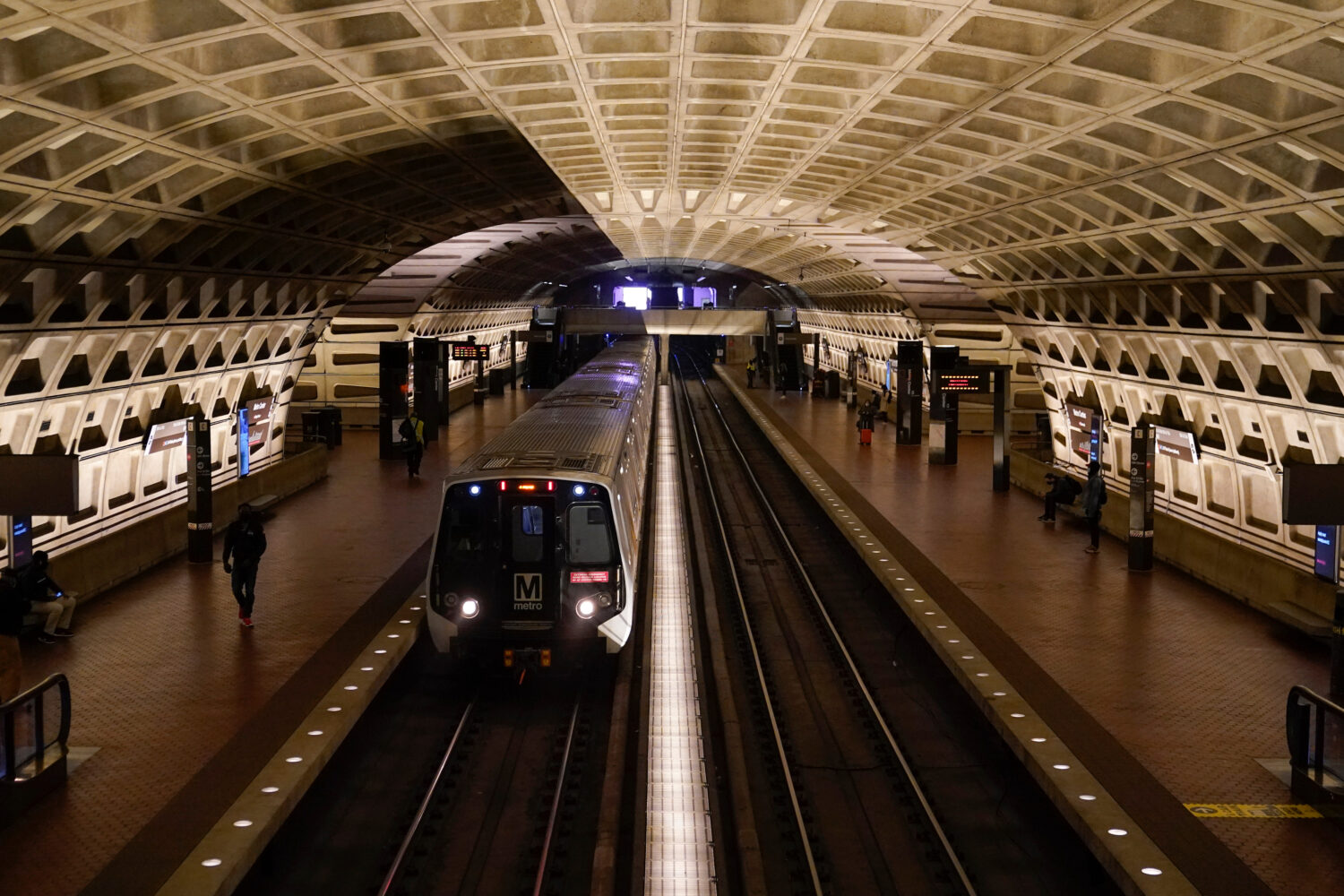 FILE - A train arrives at Metro Center station, April 23, 2021, in Washington. (AP Photo/Patrick Se...