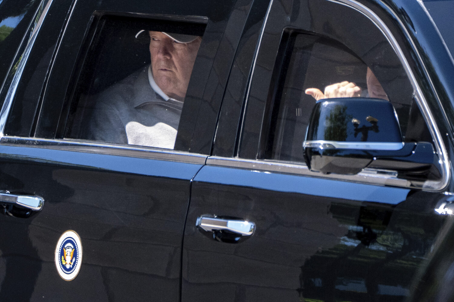 President Donald Trump looks out the window of his limousine at the construction in Lafayette Park ...