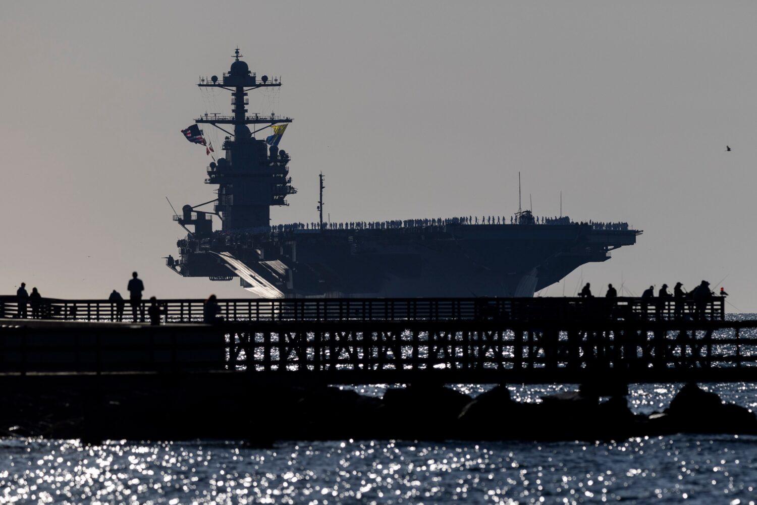 The USS Gerald R. Ford heads toward port at Naval Station Norfolk, as seen from Fort Monroe, Va., o...