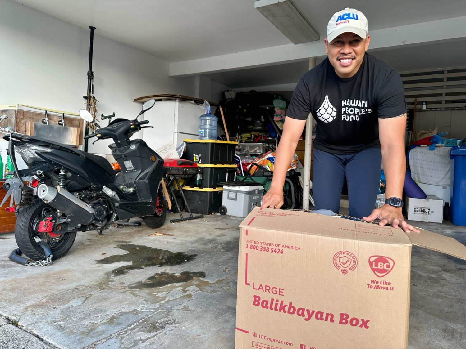 Sergio Alcubilla stands with a balikbayan box he sealed in Honolulu, on Monday, May 11, 2026. (AP P...