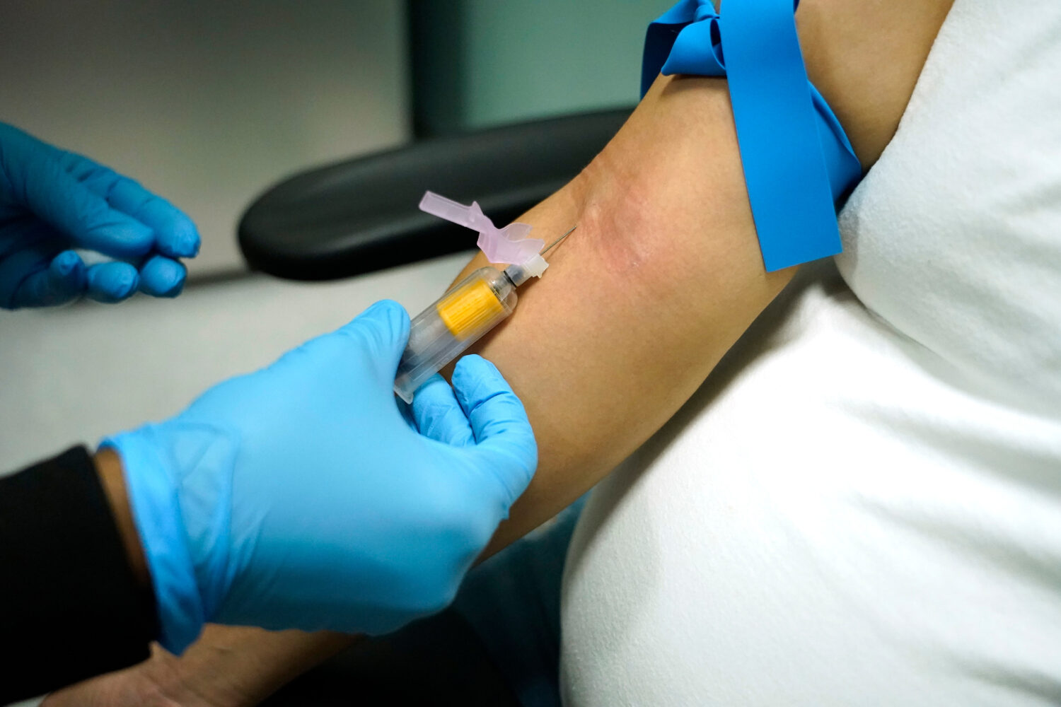 FILE - A technician draws blood at a women's clinic in Jackson, Miss., on Dec. 17, 2021. (AP Photo/...