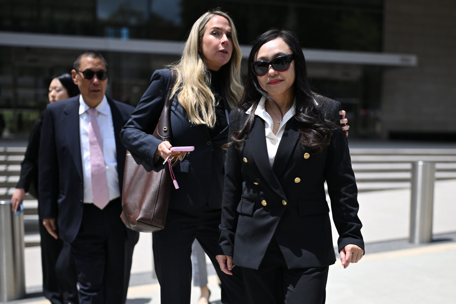 Eileen Wang, the former mayor of Arcadia, Calif., at right, exits federal court after pleading guil...