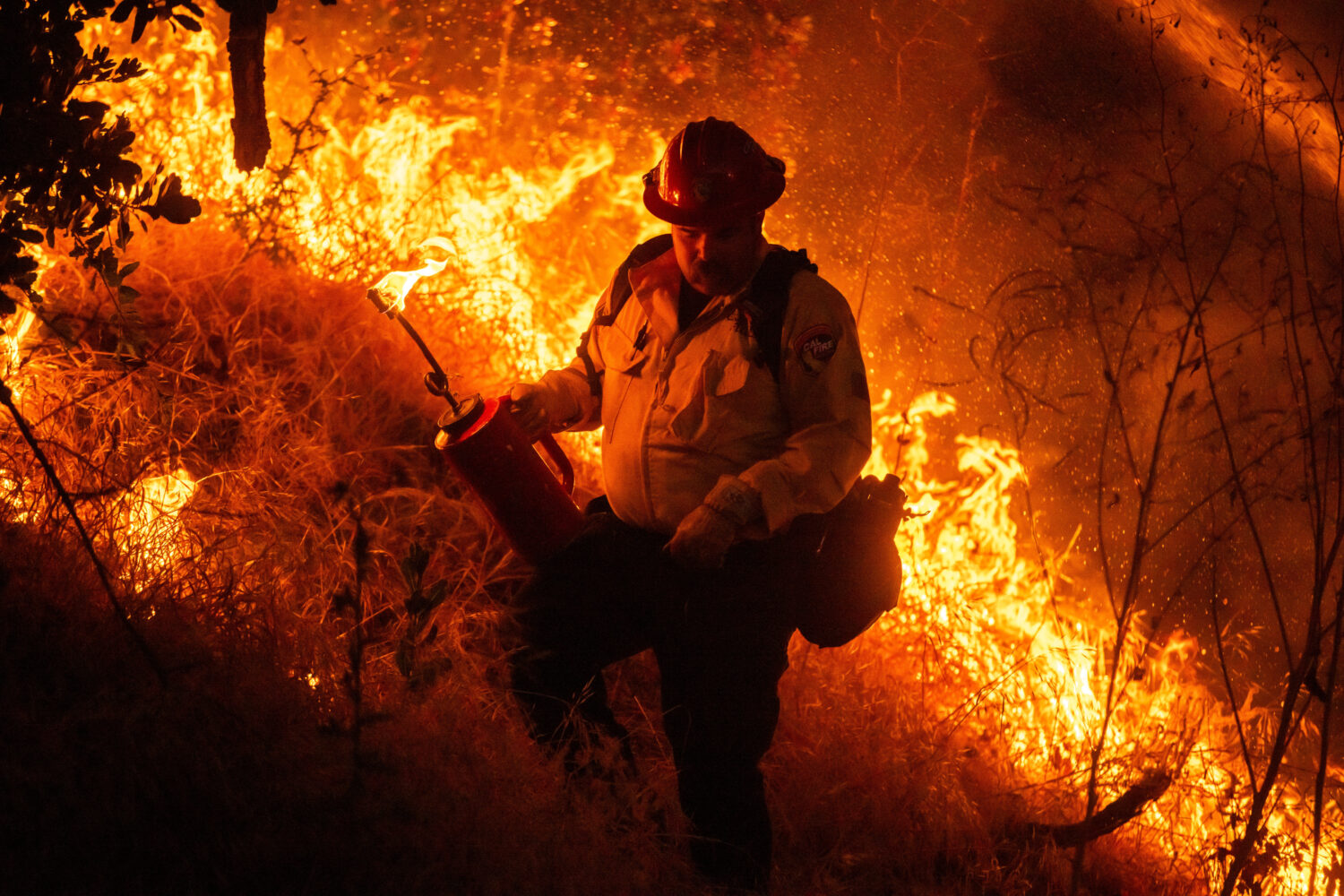 Fire crews conduct a firing operation to control the Sandy Fire Monday, May 18, 2026, in Simi Valle...
